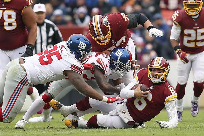 LANDOVER, MD - DECEMBER 09:Quarterback Mark Sanchez #6 of the Washington Redskins is sacked by defensive back Sean Chandler #36 and defensive end B.J. Hill #95 of the New York Giants in the first quarter at FedExField on December 9, 2018 in Landover, Maryland. (Photo by Patrick Smith/Getty Images)
